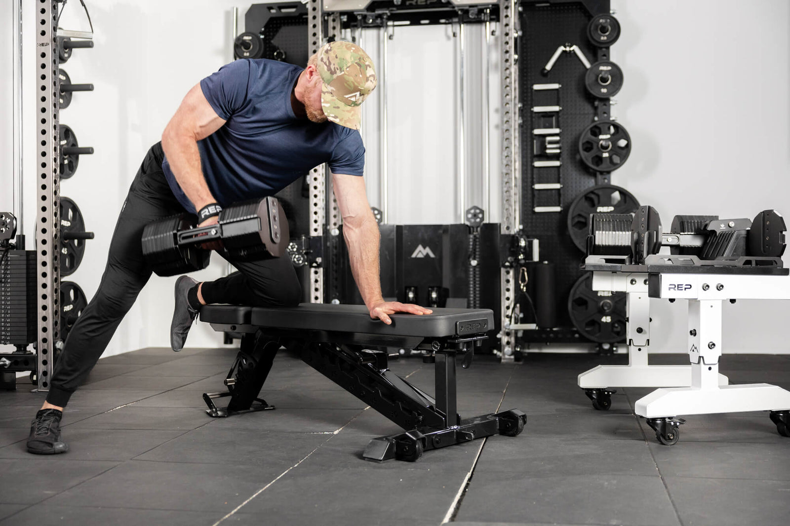 Athlete lifts with the REP® x PÉPIN™ Fast Series™ Adjustable Dumbbells.